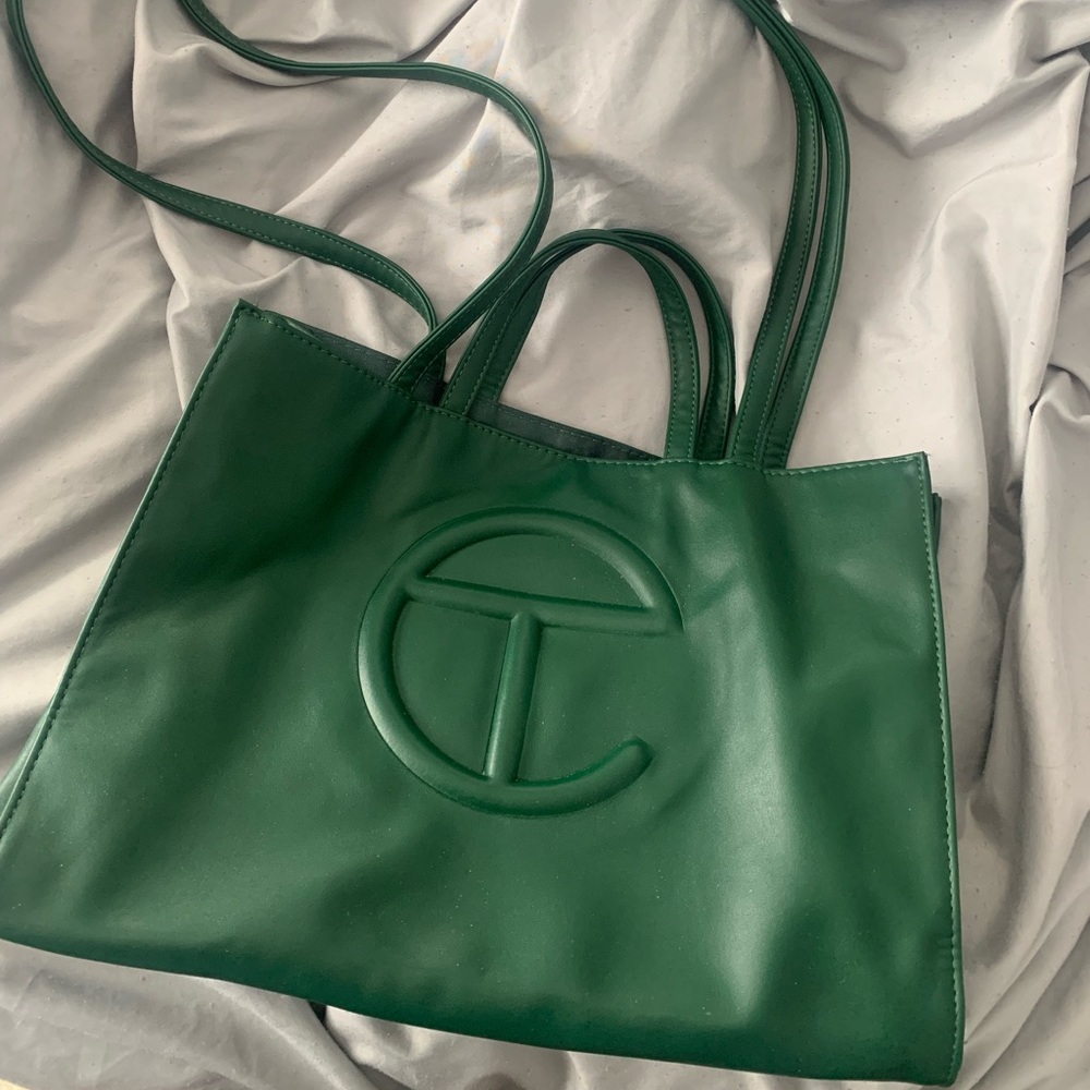 Medium size hunter green telfar bag.
